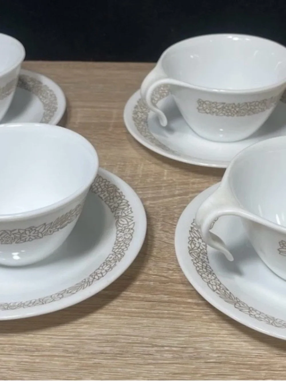 Set of (4) corelle pyrex coffe cups with saucers “woodland ” hook handles
